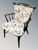 A Scandinavian spindle backed chair with floral cushion