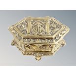 A cast brass lozenge shaped ring box depicting William Shakespeare,