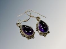 An old pair of silver and amethyst earrings