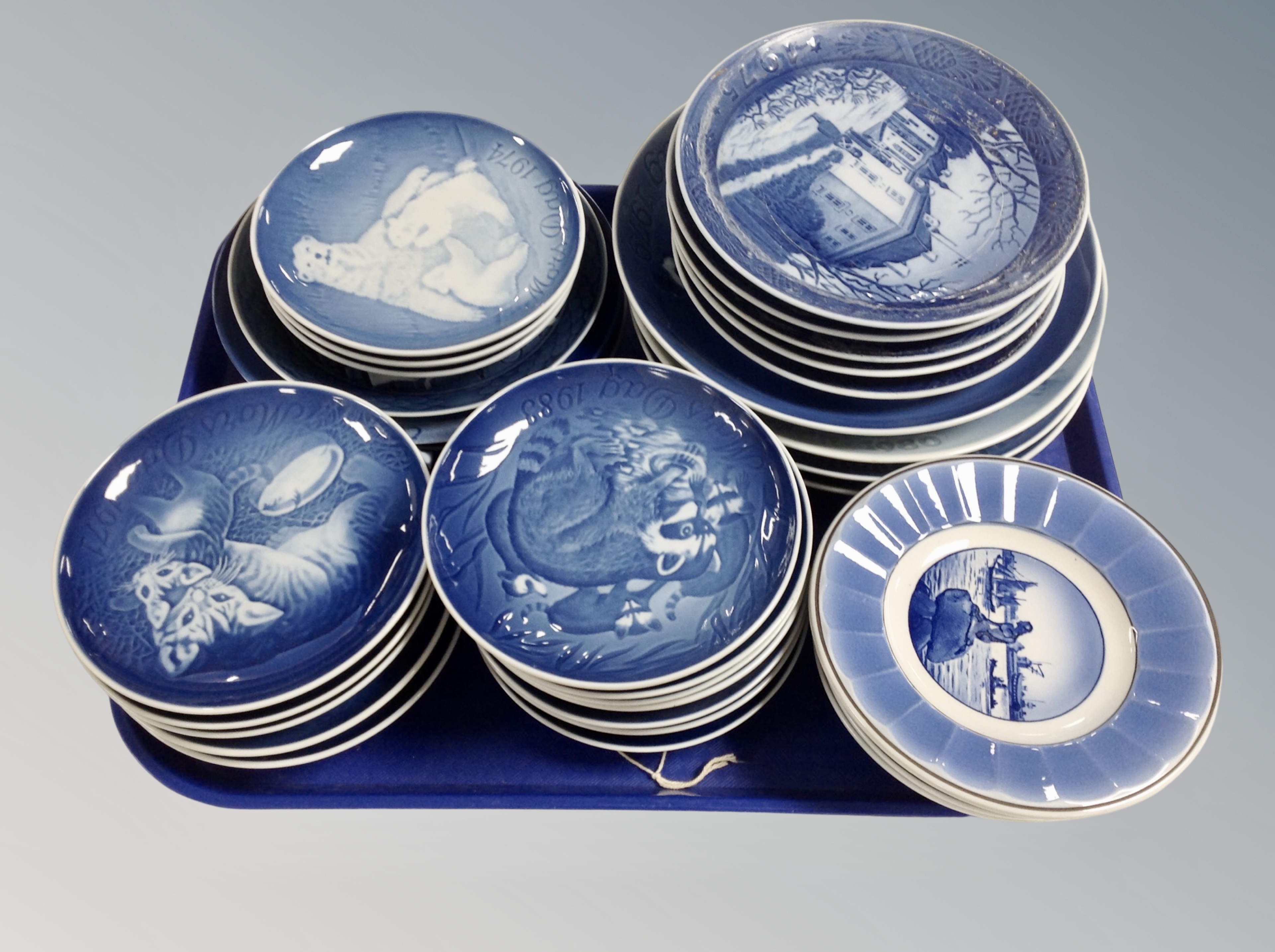 A tray of Bing and Grondahl blue and white porcelain commemorative plates.