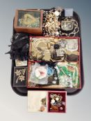 A tray containing assorted costume jewelry, metal mesh purses, faux pearls, locket on chain etc.