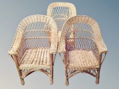 Three wicker conservatory armchairs