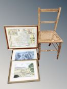 An Edwardian bergere bedroom chair with a map of Northumberland and two further pictures