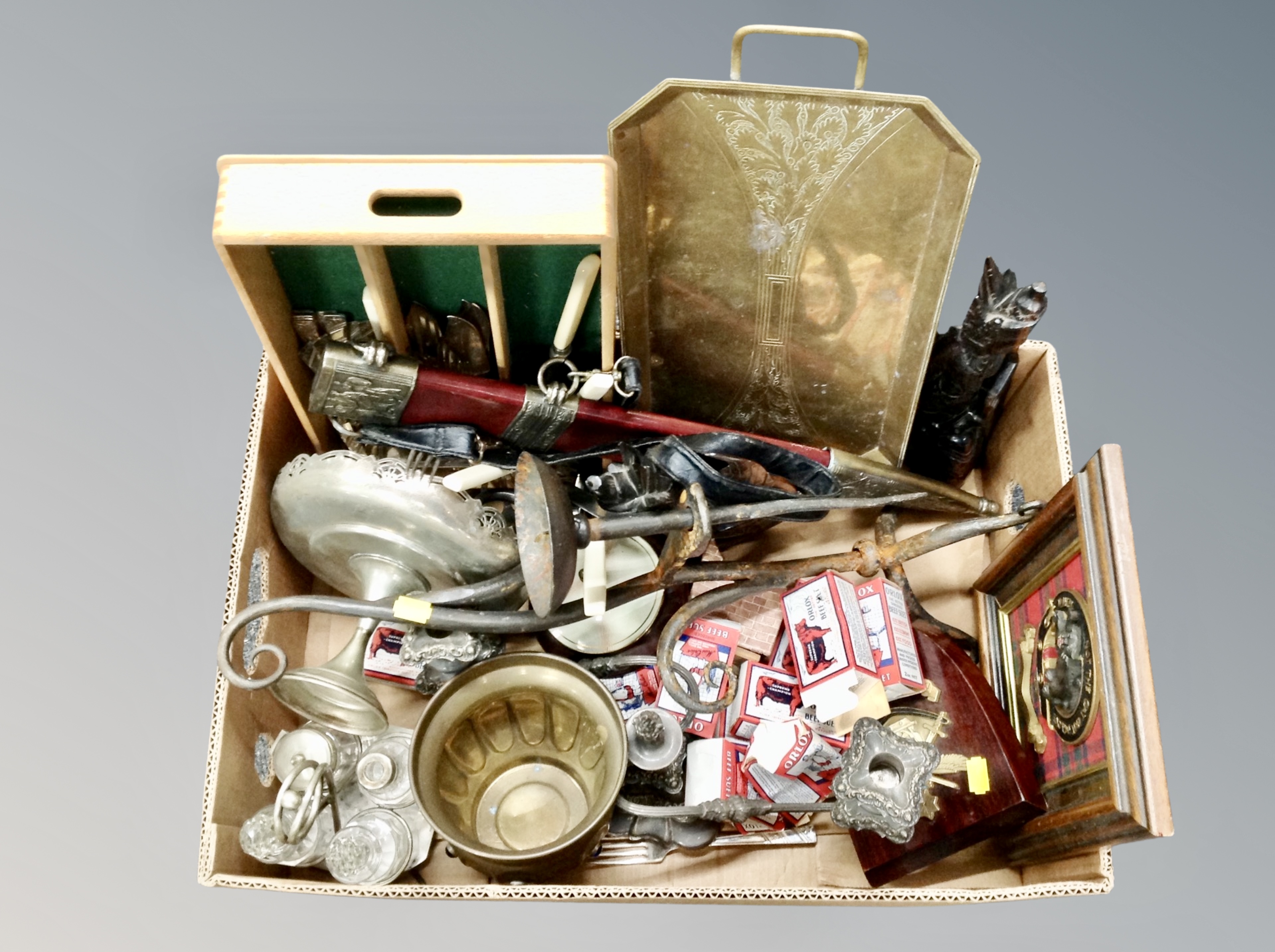 A box containing plated wares, cruet, brass serving tray, cutlery tray, sword in sheath etc.