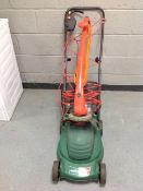 A Qualcast electric lawn mower and a Flymo strimmer