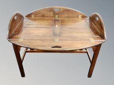 A butler's table with lift off tray top