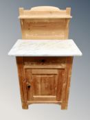 A pine wash stand with marble top,