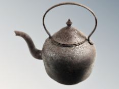 A 19th century cast iron kettle.