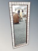 A Scandinavian rectangular tiled inset mirror,