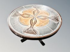 A Scandinavian tiled circular coffee table,