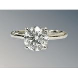 A platinum diamond solitaire ring, the brilliant-cut stone weighing 1.