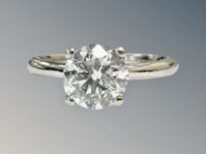 A platinum diamond solitaire ring, the brilliant-cut stone weighing 1.