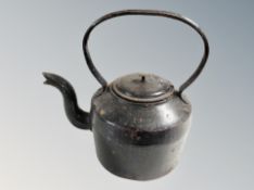 A 19th century cast iron kettle.