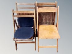 A set of four folding kitchen chairs with cushions,
