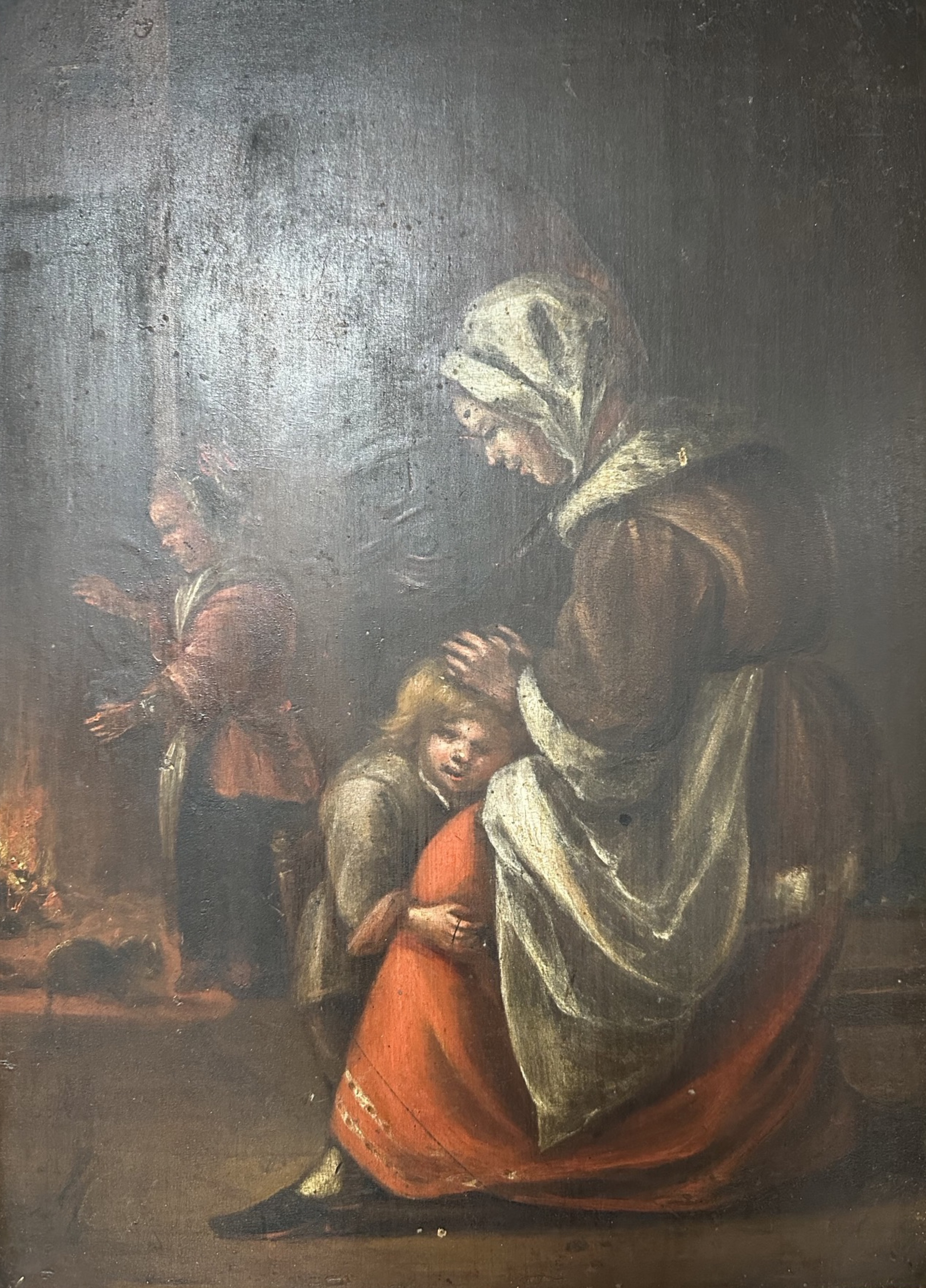 An antiquarian oil on board of a mother with children in dimly lit interior