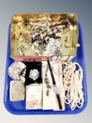 A tray of tin of costume jewellery, faux pearl necklaces, wrist watches,