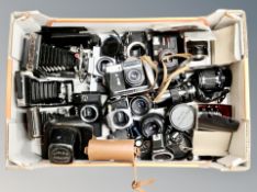 A box of a large quantity of assorted cameras including Kodak, Zenit, Canon, lenses etc.