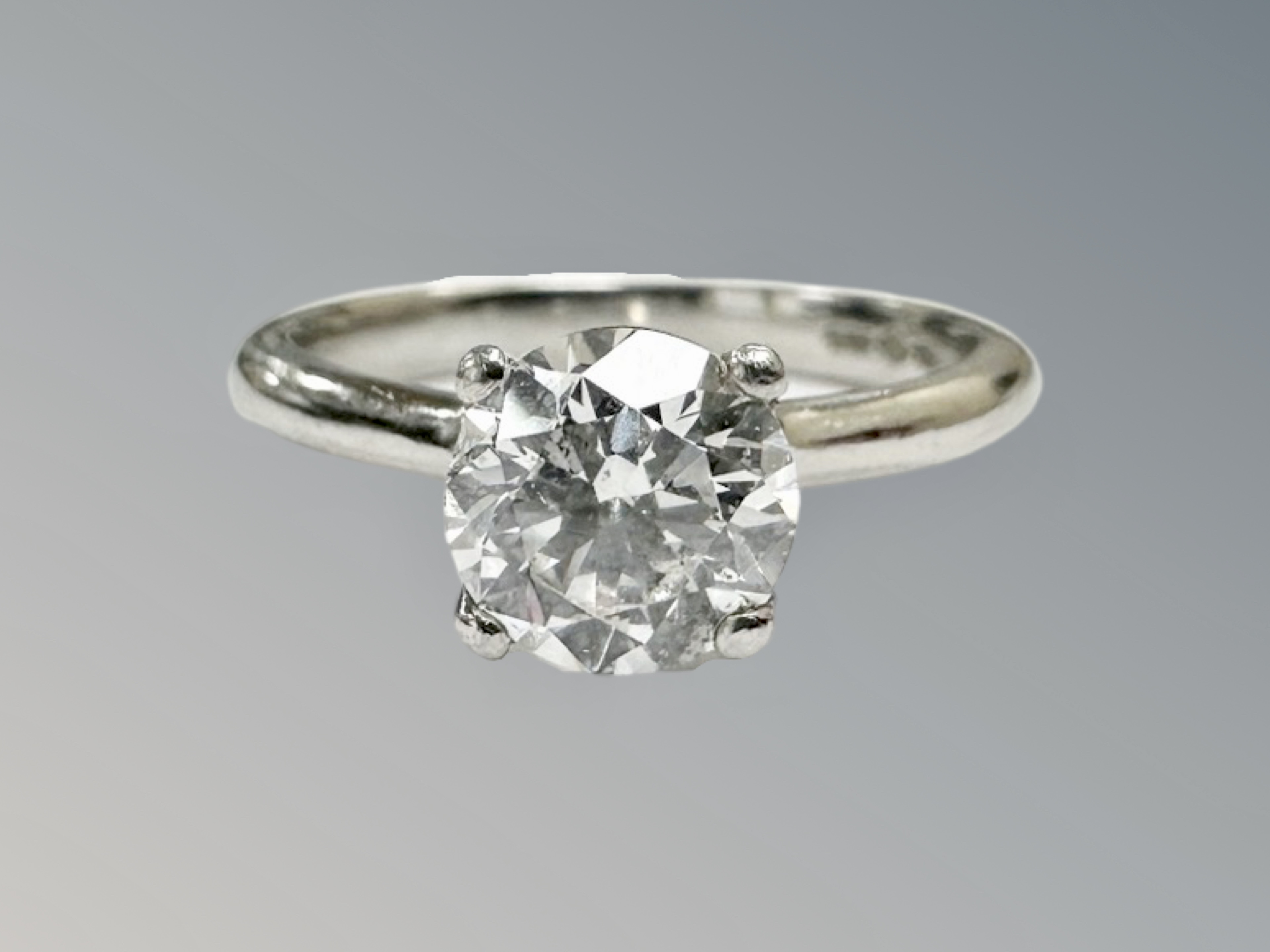 A platinum diamond solitaire ring, the brilliant-cut stone weighing 1. - Image 2 of 3