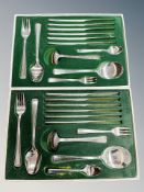 Two boxed sets of stainless steel cutlery