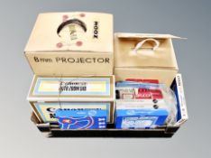 A box containing slide projectors and related accessories.
