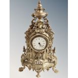 An ornate cast brass mantel time piece, height 40 cm.