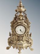 An ornate cast brass mantel time piece, height 40 cm.