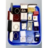 A tray of costume jewellery, rolled gold bangle, silver and dress rings, watch,