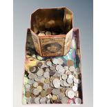 A tray and tin containing assorted British and Foreign coins