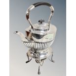 A good quality silver-plated spirit kettle on stand with burner,