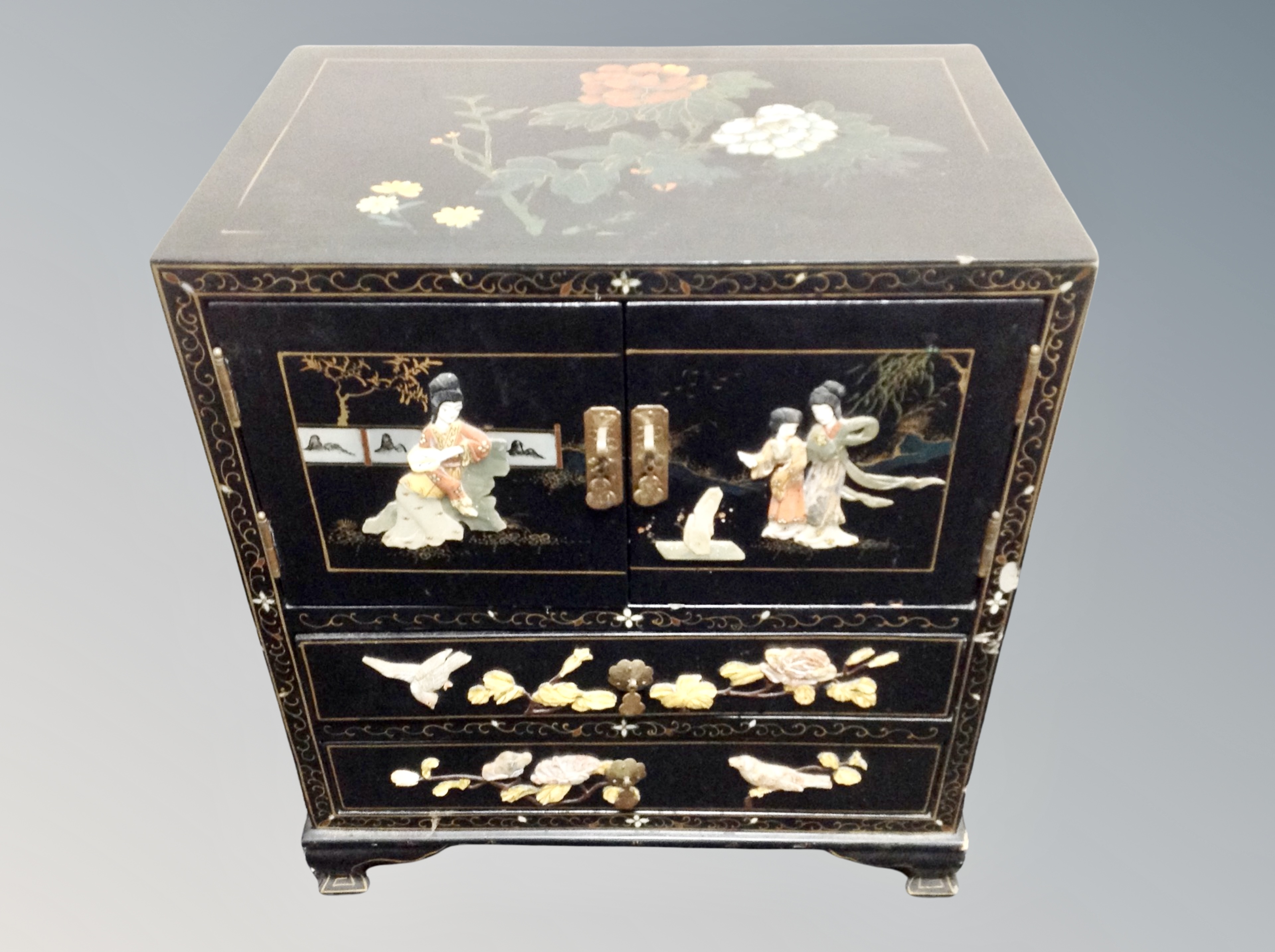 A Japanese lacquered and hard stone inlaid table cabinet,