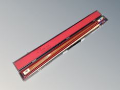 A two-piece Riley snooker cue in case