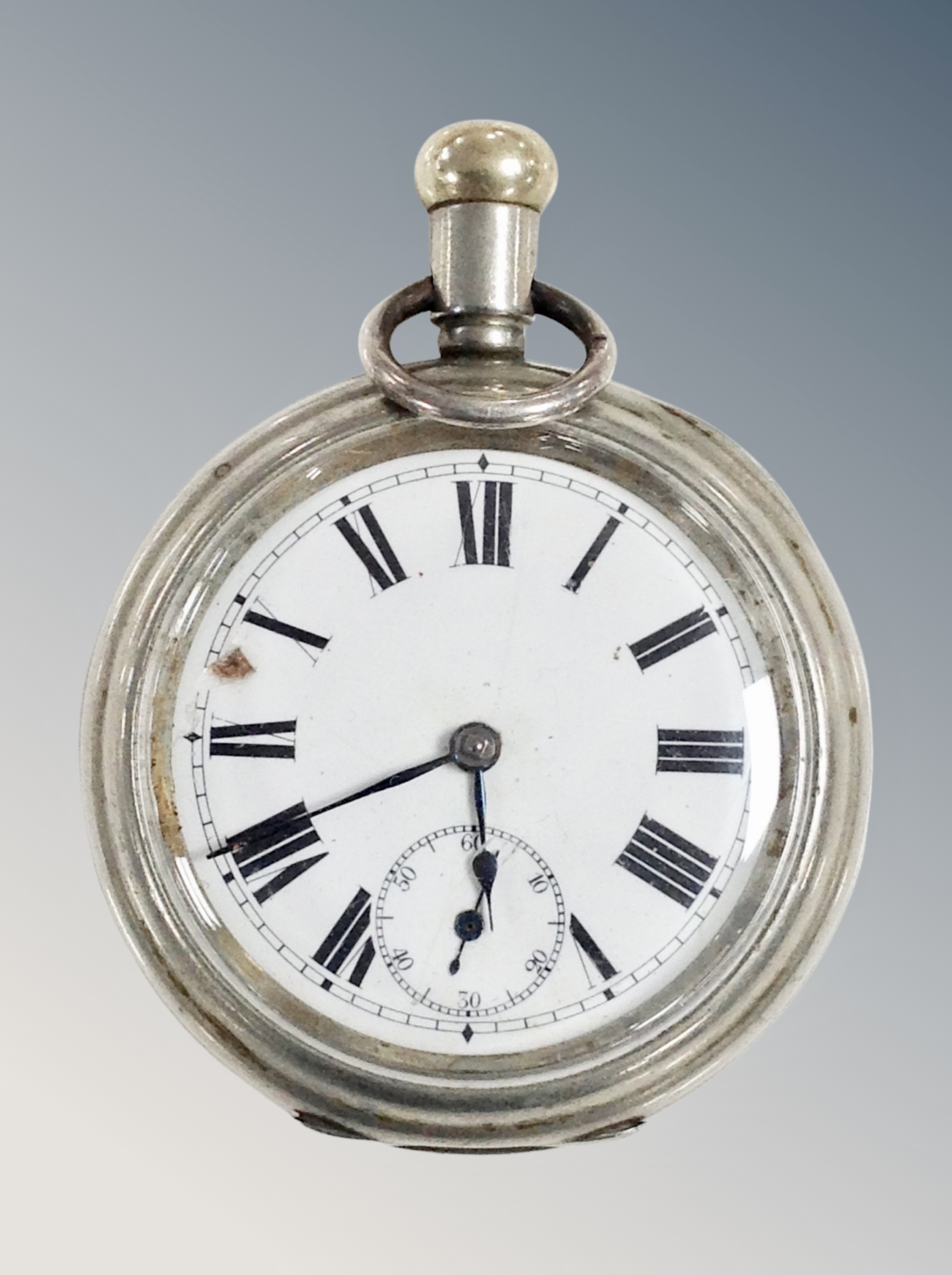 An oversized pocket watch,