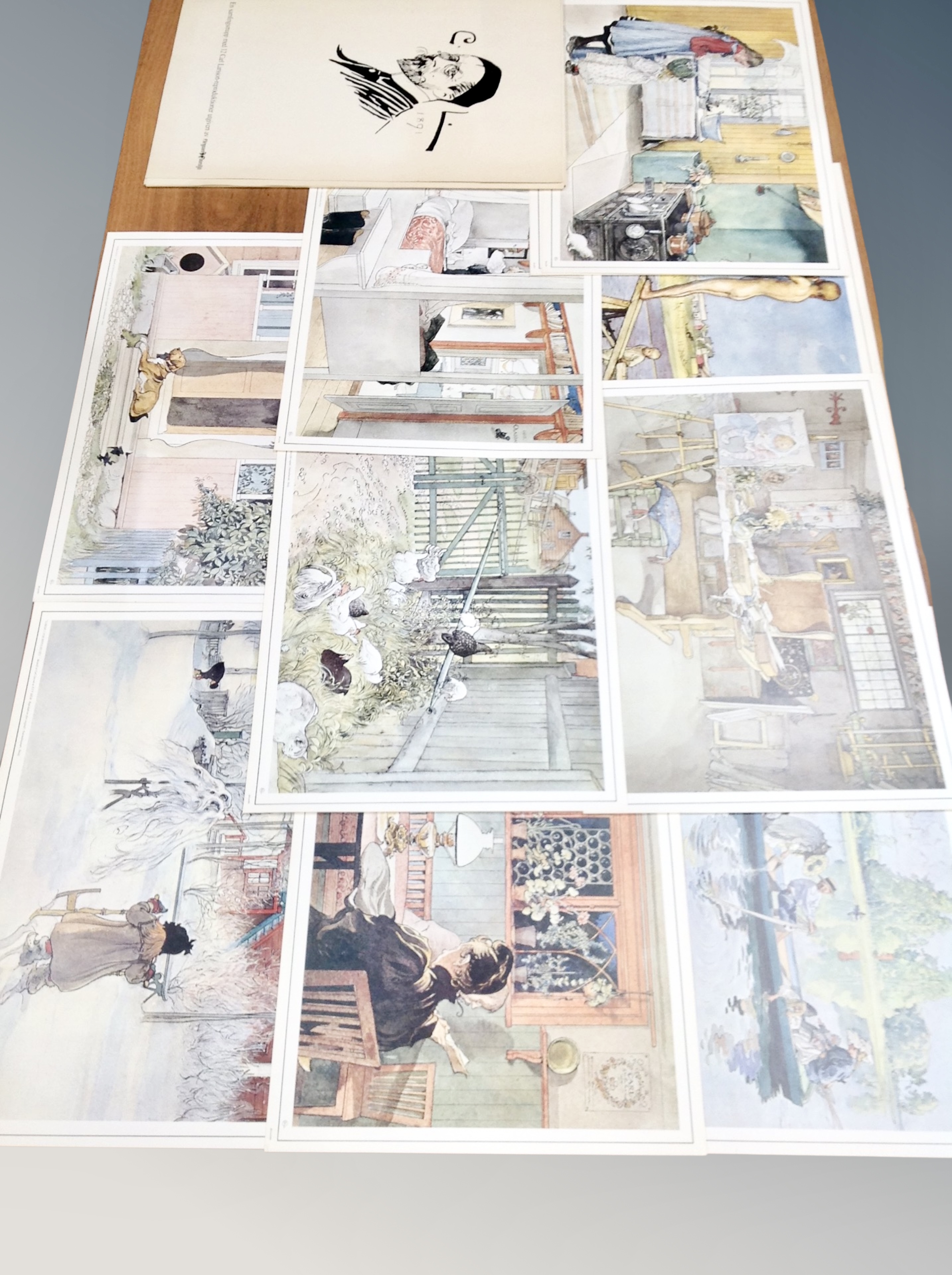 A folio of twelve Carl Larsson colour prints