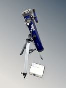 An Optus telescope on tripod together with a further box containing related accessories.