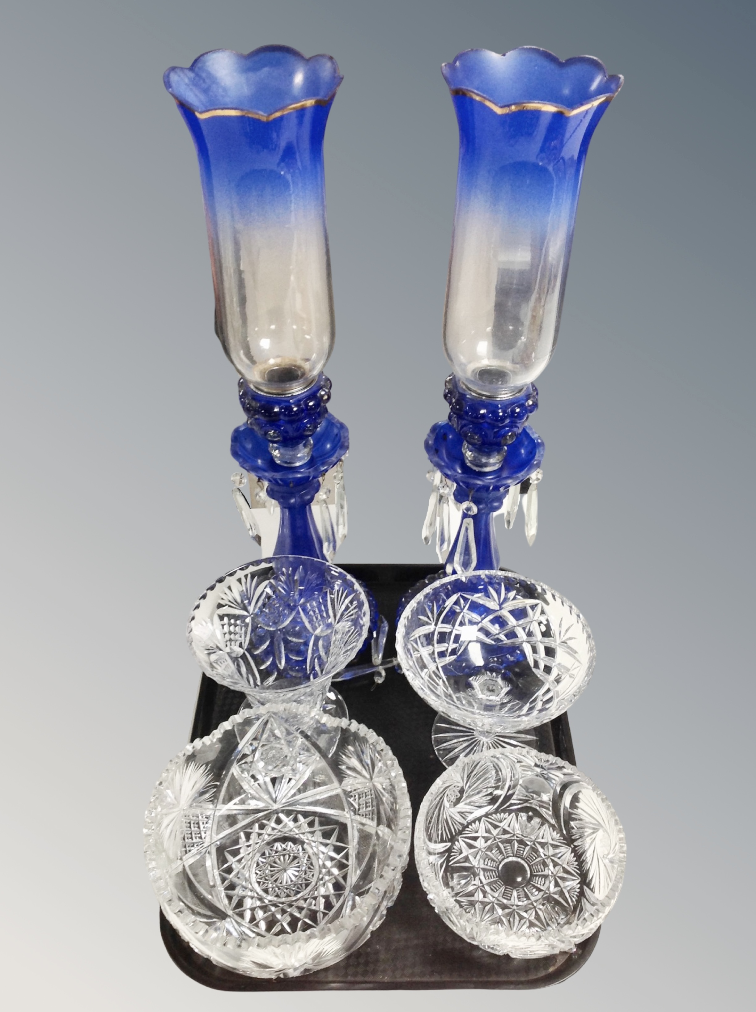 A pair of two-tone blue glass table lustres with crystal droplets,