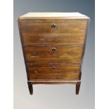 A Scandinavian stained pine three drawer chest,