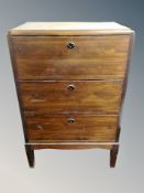 A Scandinavian stained pine three drawer chest,