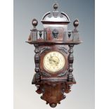 A continental mahogany cased 8 day wall clock.