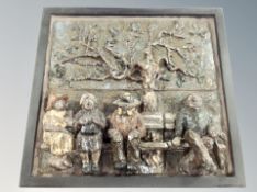 A studio pottery relief plaque depicting figures on a bench