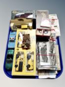 A tray containing boxed and unboxed Die cast vehicles, coins, two football medals, cigarette cards,