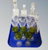 A tray containing set of five two-tone glass champagne glasses,