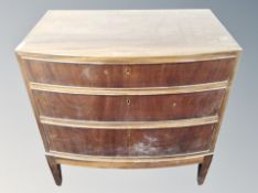 A Scandinavian mahogany three drawer bow fronted chest,