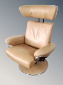 A Stressless chrome and tan leather upholstered swivel armchair