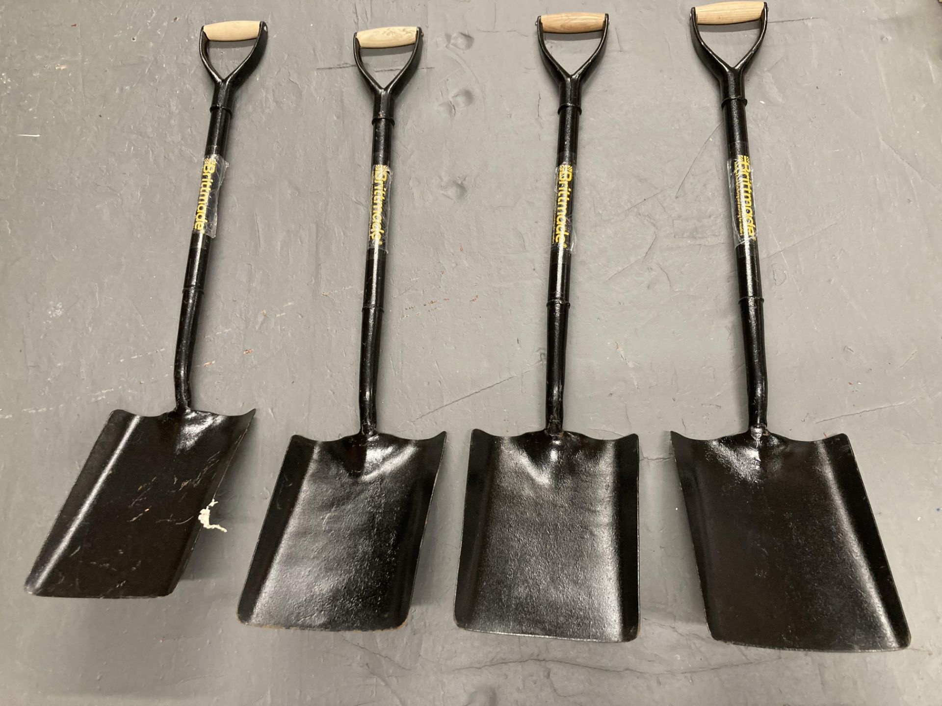 Four Britmade metal spades.