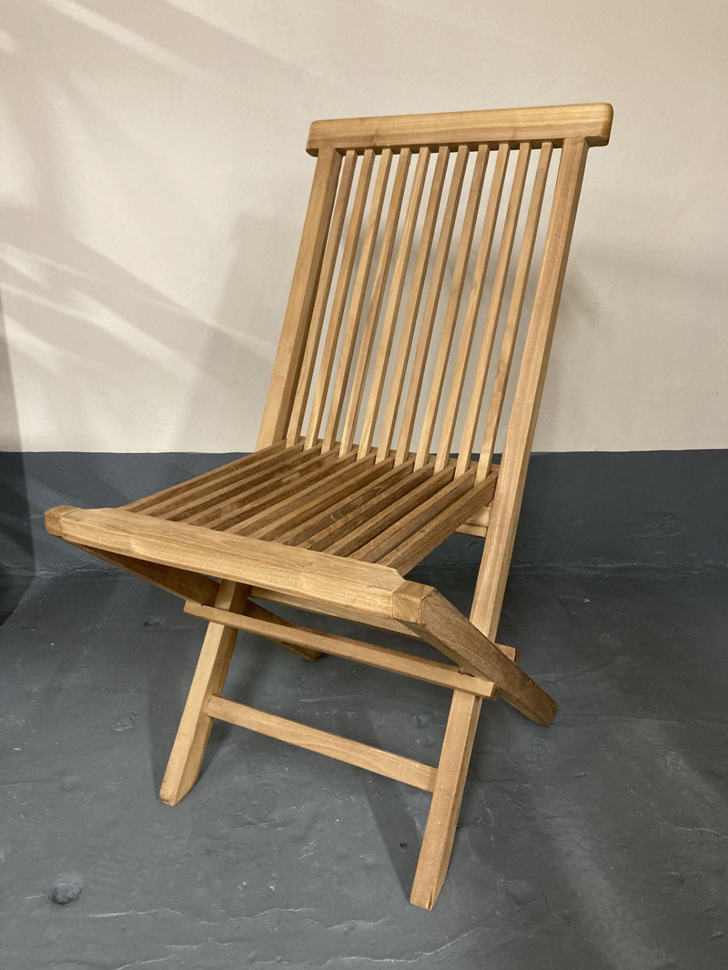 A teak folding steamer chair.