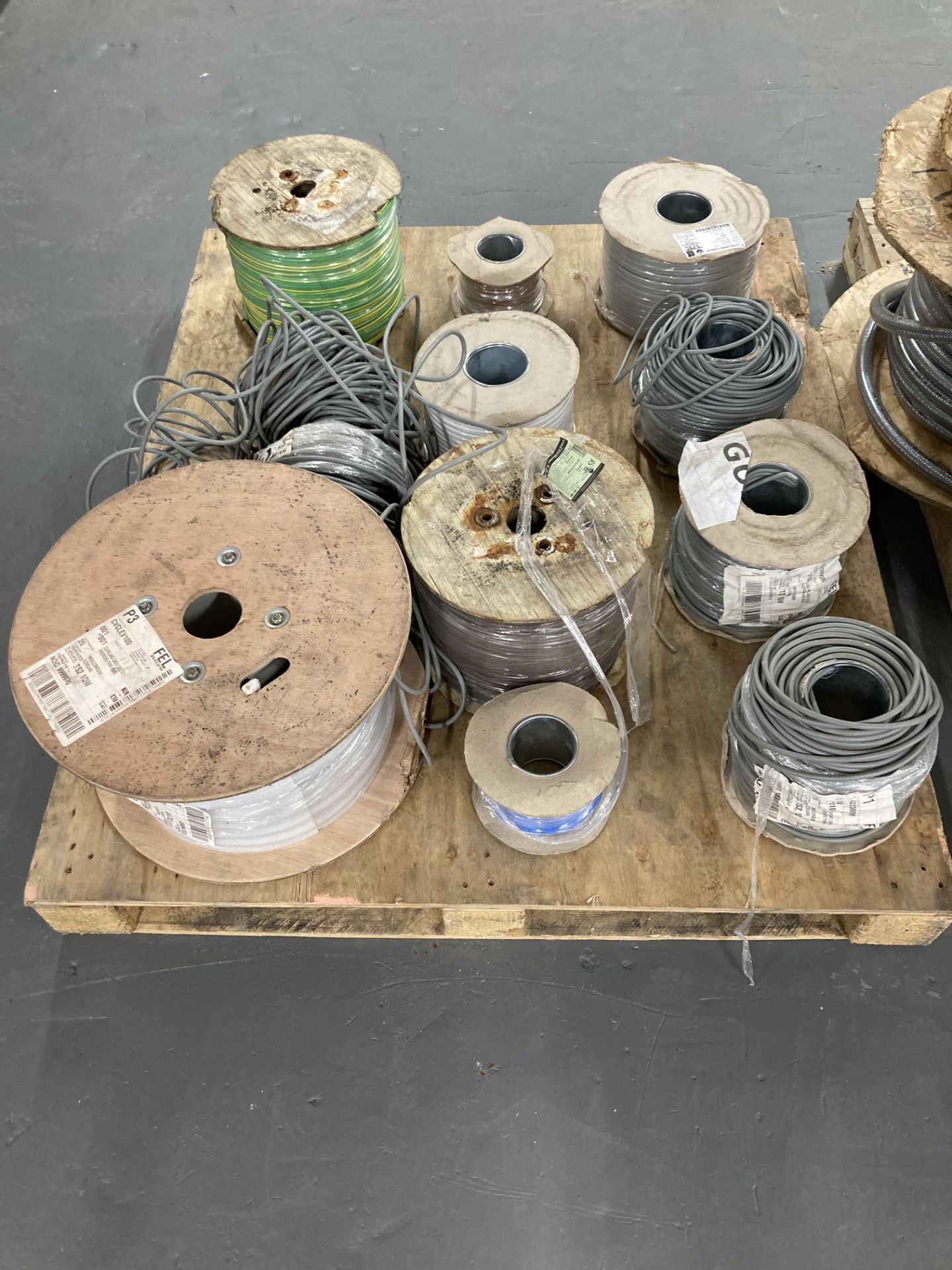 Eleven spools of various electrical cable