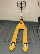 A yellow 2500kg pallet truck