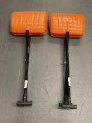 Two orange head plastic grabbing shovels.