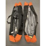 Two drywall electric strata sanders in carry bags.