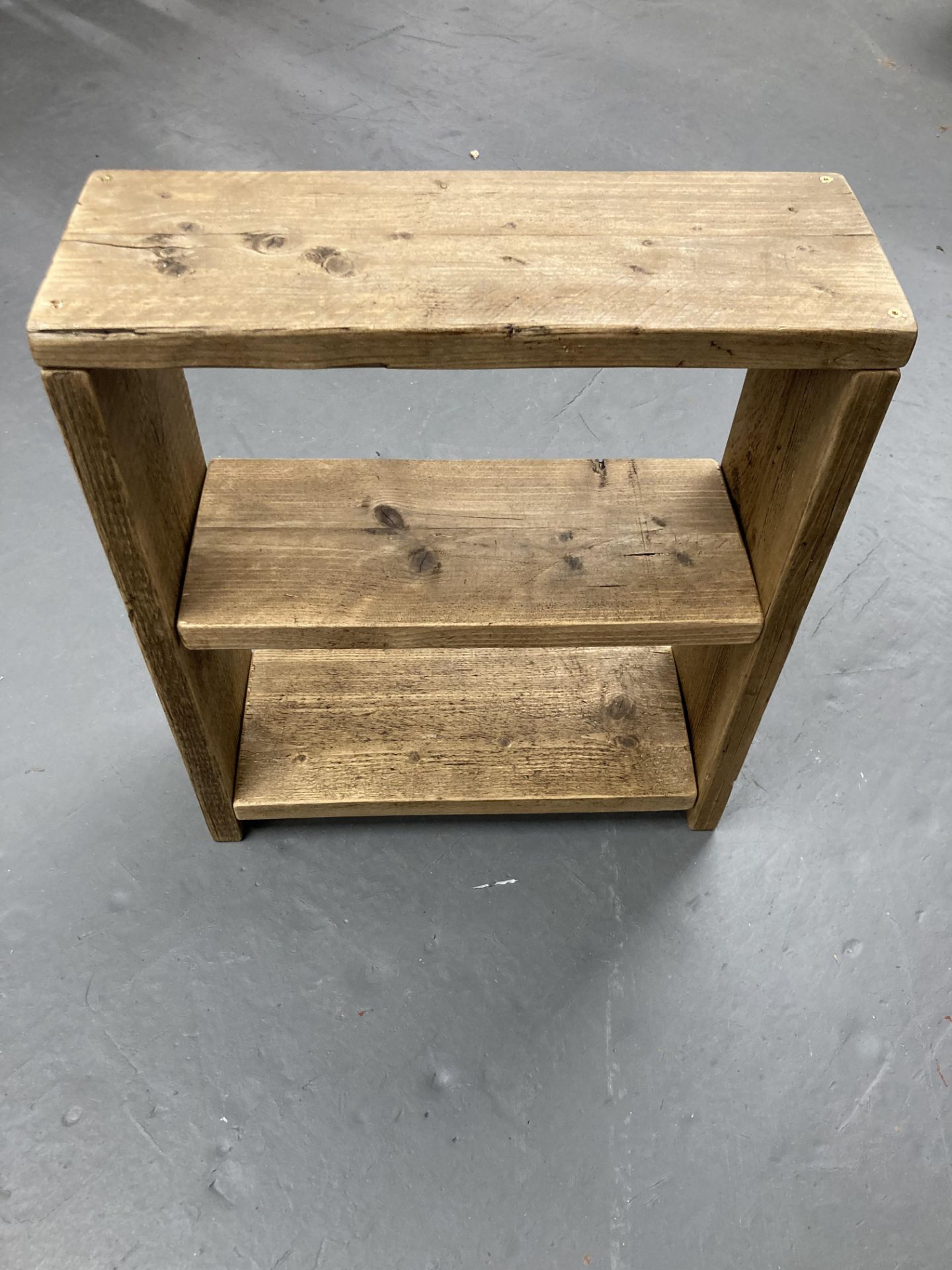 A small rustic pine bookshelf